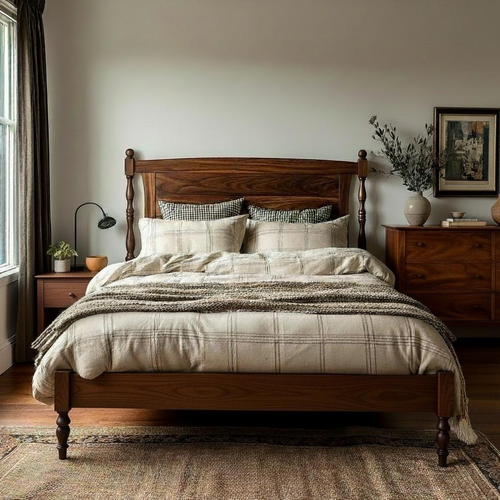 Bedroom with wooden bed and side tables, lamp, and decor.
